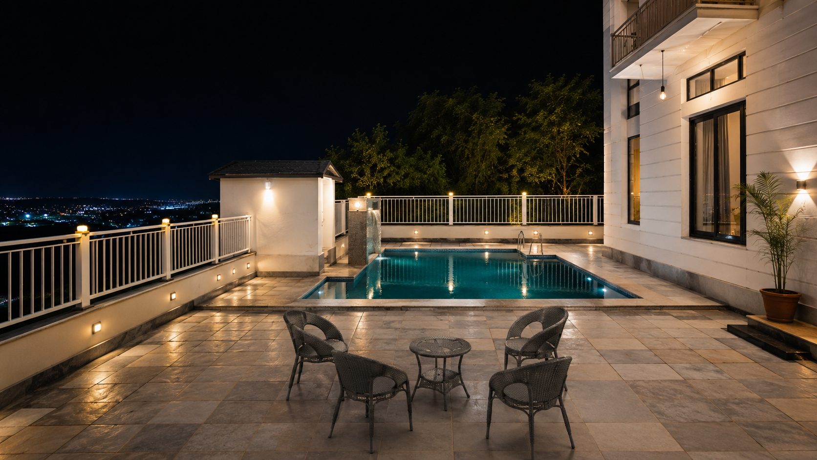 Swimming pool and seating area at Shree Niwas homestay, Udaipur